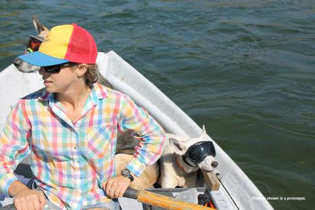 Woman rowing boat with dogs wearing Rex Specs Dog Goggles